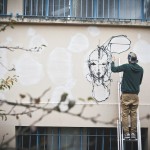 Street artist Iemza painting at La Fileuse, Reims, France 2