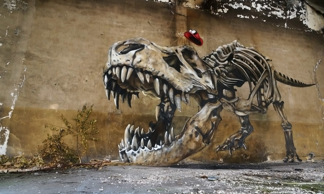 Graffiti of a dinosaur skeleton by SCAF in Lorraine, France