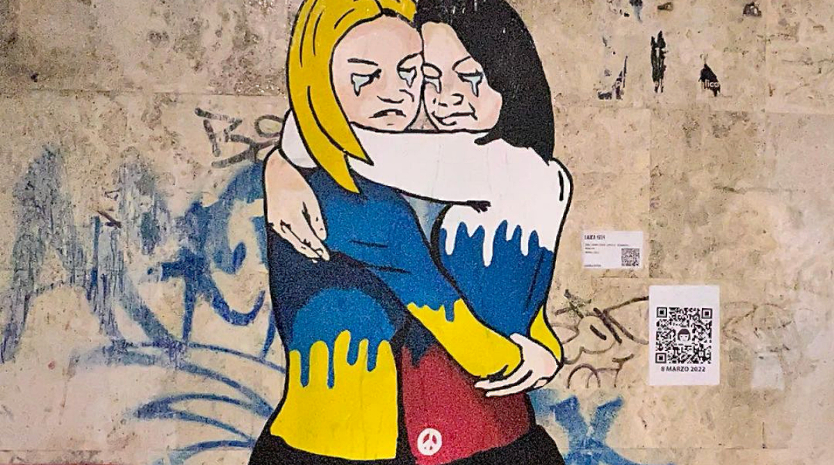 PEACE – Russian and Ukrainian women hugging when the war Putin started going on