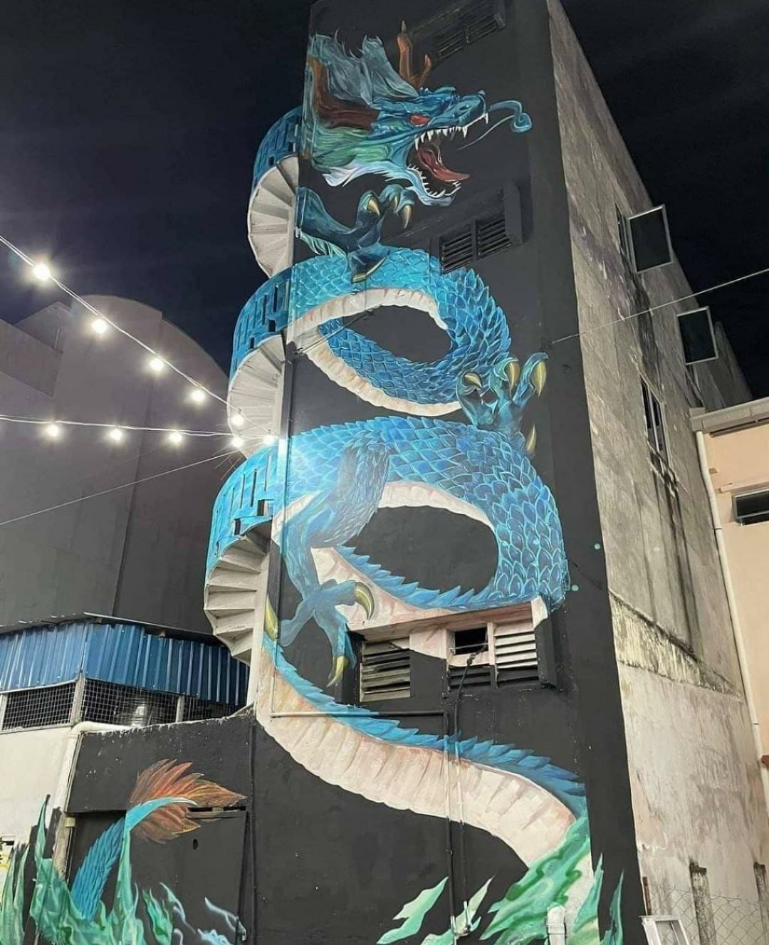 The Giant Greenish-Blue Dragon Mural That Comes to Life on a Three-Storey Building