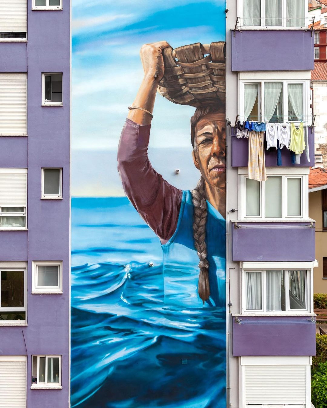 Mural by Muraleslian in Mutriku, Spain.